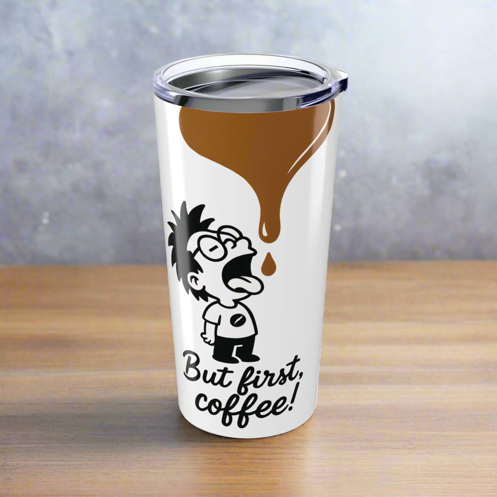 White stainless steel tumbler with a glossy finish, featuring a black and white cartoon character design and the text 'But first, coffee!' with a drip of coffee coming down the side.