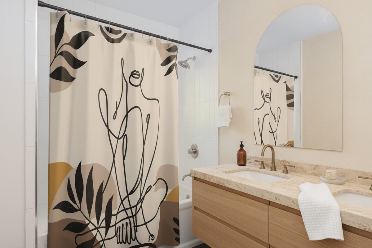Beige line art shower curtain beside a wooden vanity and arched mirror, with the curtain reflected in the mirror.