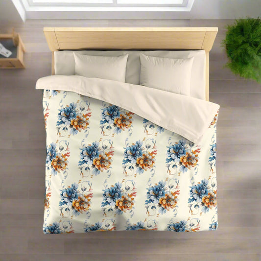 A duvet cover with a floral pattern, featuring large colorful flowers on a light background, displayed on a bed with pillows.