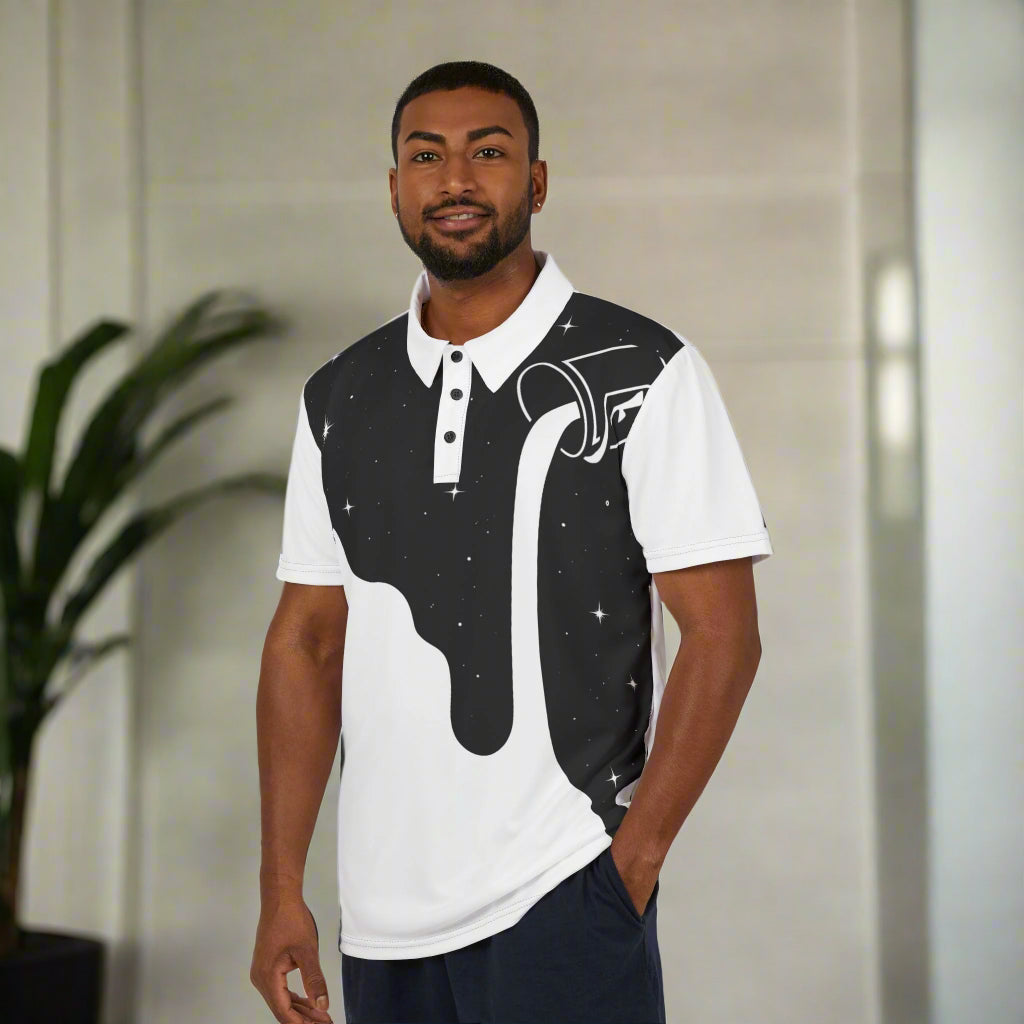 A man wearing a white and black geometric patterned polo shirt with a pointed collar and a three-button placket.