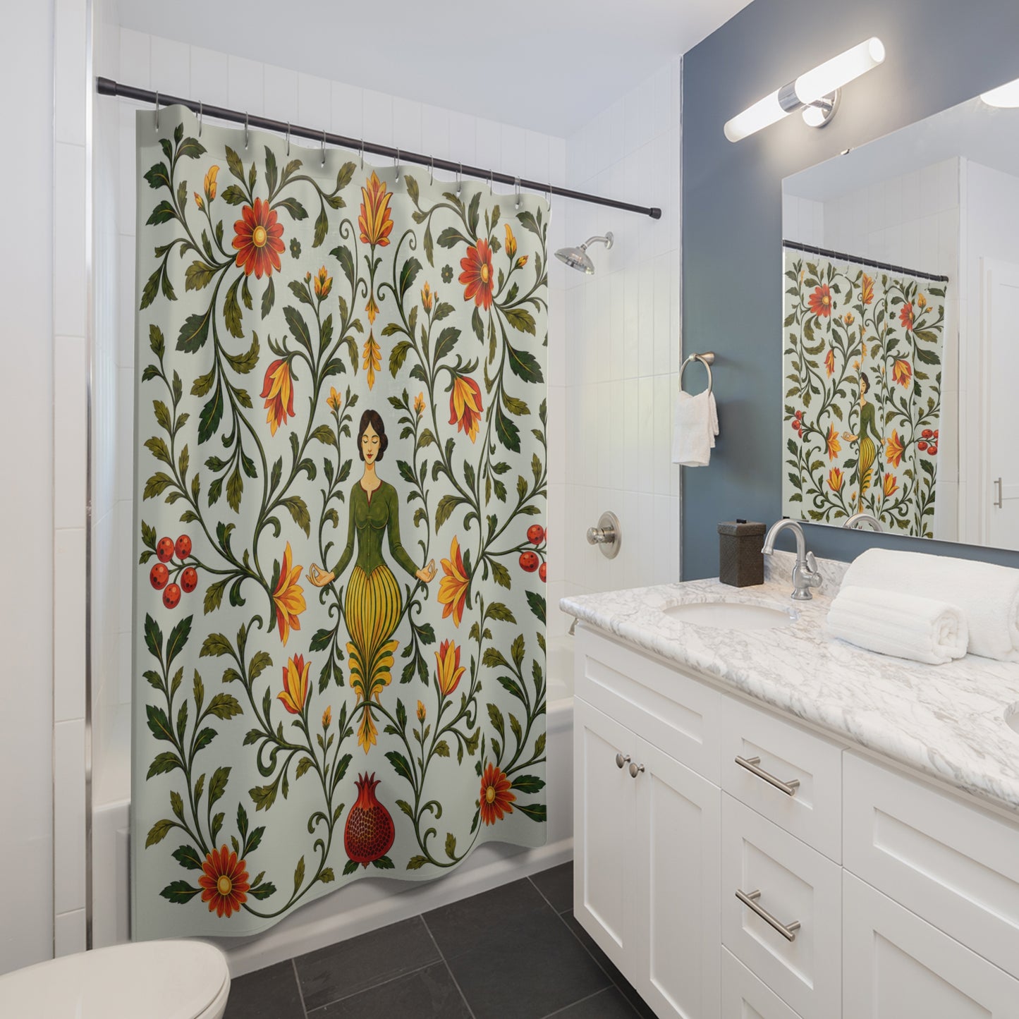 A floral shower curtain with a vintage botanical pattern and a central female figure, hanging in a modern white and blue-gray bathroom next to a marble vanity.