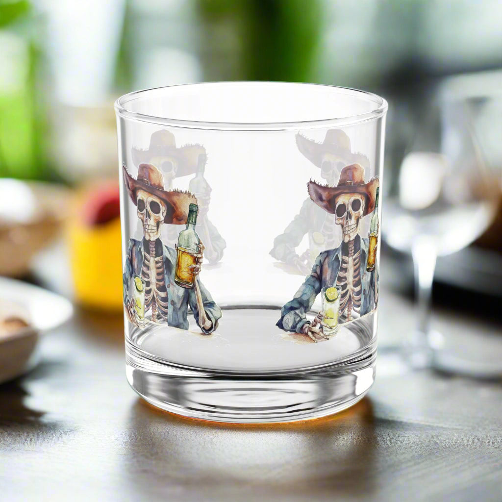 Clear glass tumbler with skeleton cowboy design