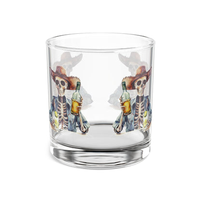 Clear glass tumbler with skeleton design holding bottles 