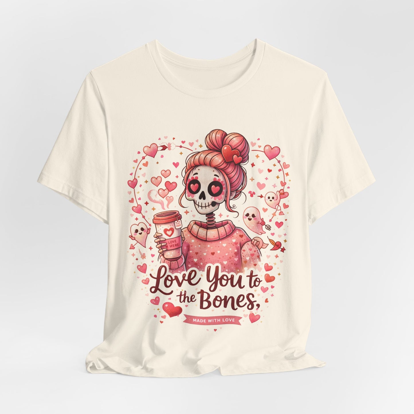 Pastel goth Valentine illustration showing a smiling skull girl, heart eyes, coffee cup, and floating cupid ghosts with romantic pink accents.