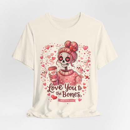 Pastel goth Valentine illustration showing a smiling skull girl, heart eyes, coffee cup, and floating cupid ghosts with romantic pink accents.