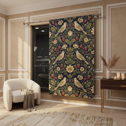 A long window curtain panel hanging on a metal rod in a modern room. The curtain features a dark navy blue background with a detailed floral and bird pattern in olive green, gold, and red.